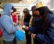Paul Washington (center) Andre Jackson (second from right) and Robert Price Jr. (right) make a sale. Paul Washington (center) Andre Jackson (second from right) and Robert Price Jr. (right) make a sale.