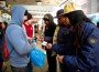Paul Washington (center) Andre Jackson (second from right) and Robert Price Jr. (right) make a sale. Paul Washington (center) Andre Jackson (second from right) and Robert Price Jr. (right) make a sale.